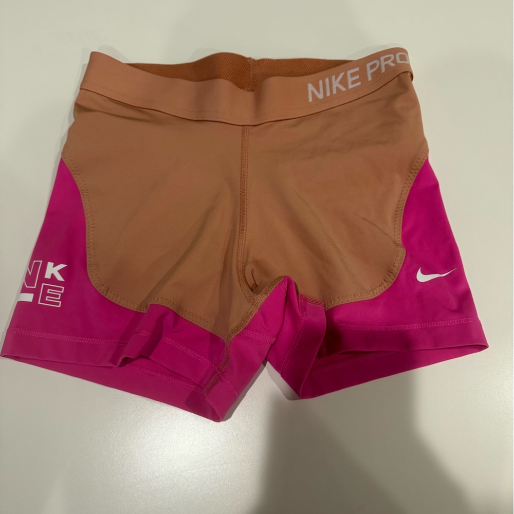Pink and tan Nike pros